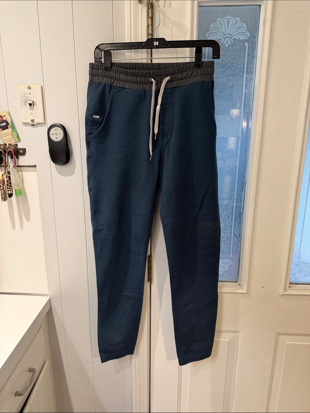Vuori Navy Joggers with Gray Waistband and White Drawstring
